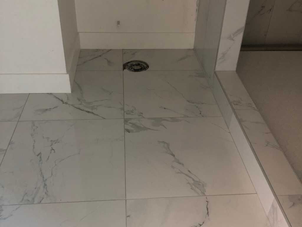 ADU showing beautiful marble tile in the walk-in shower
