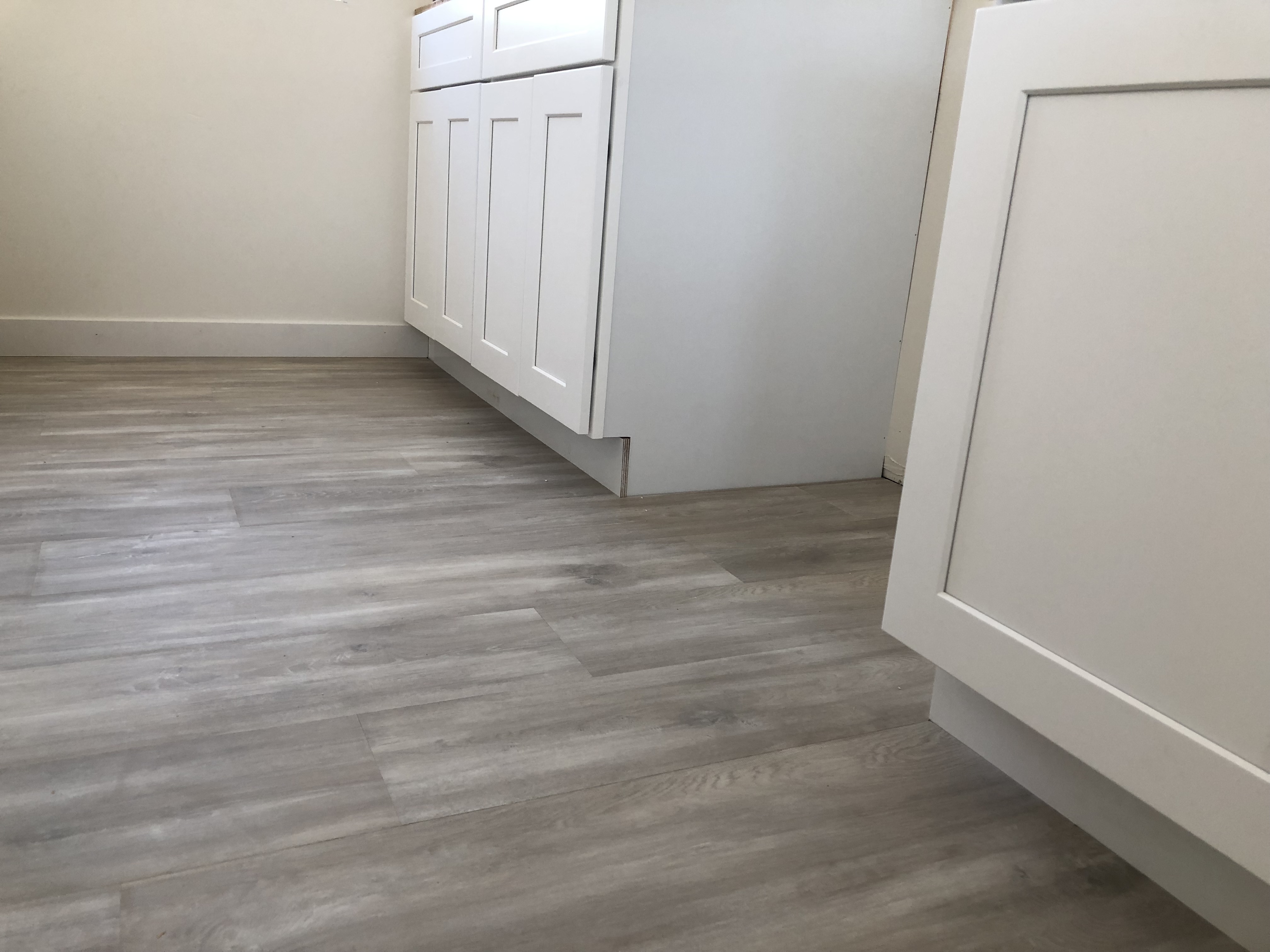 185L_ADU-showing-finish-wood-flooring-in-the-new-bathroom