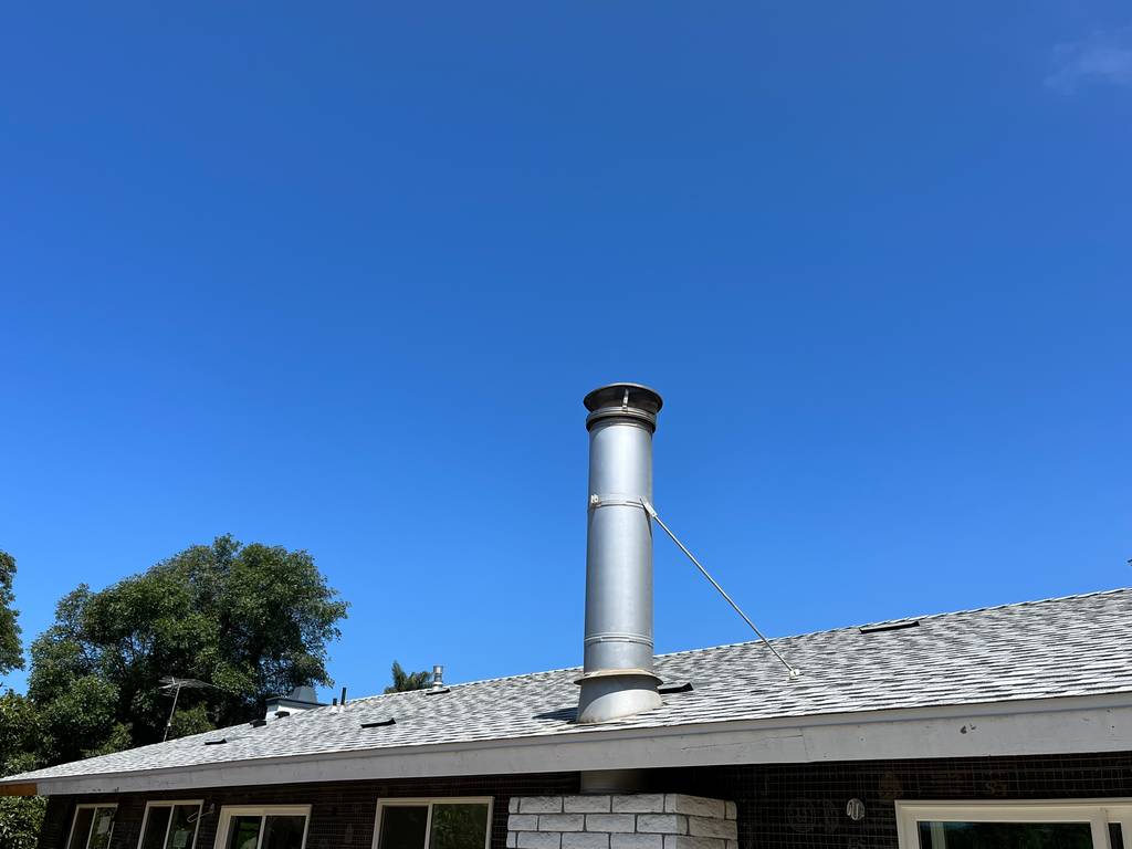 roof chimney produding from the new roof