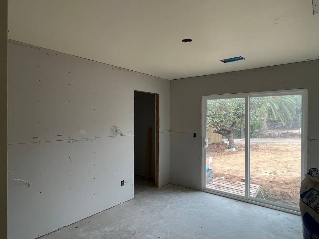Detailed Drywall Work near Windows and Ceiling.