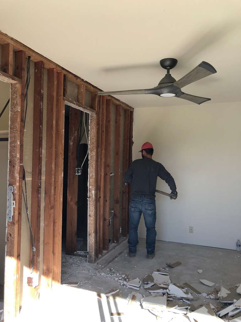 worker removing of inside wall of the home addition