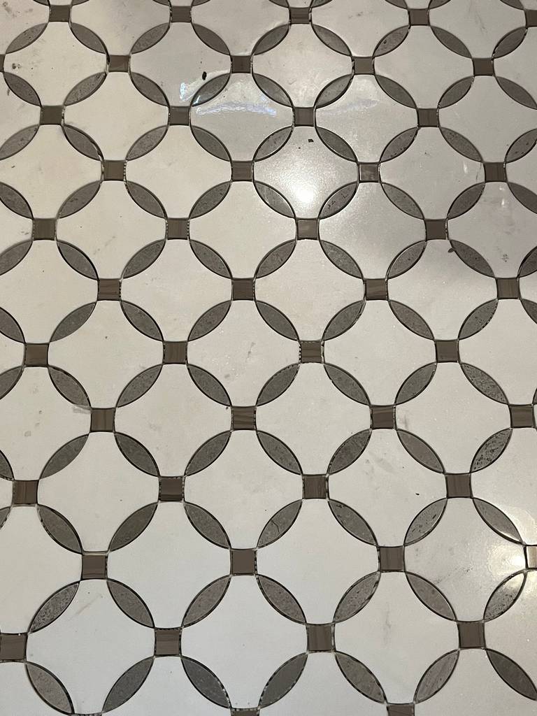 Detailed view of artistic tile design in the remodeled bathroom