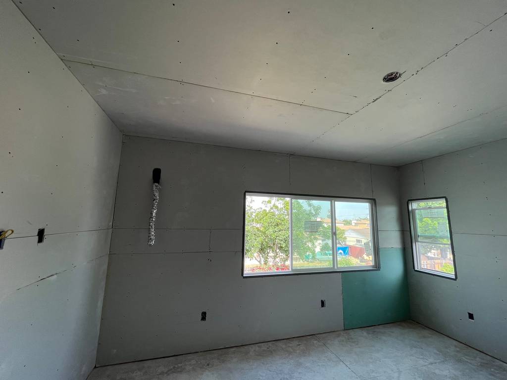 drywall on the walls and ceiling of the home addition