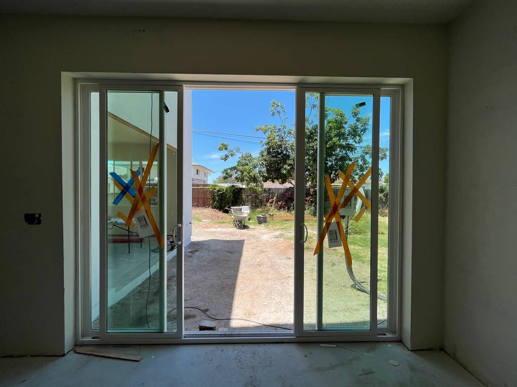 drywall applied around sliding glass door