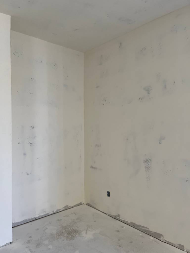 fresh joint compound applied to walls and ceiling