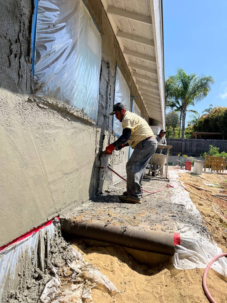 Stucco Masons Using Specialized Tools