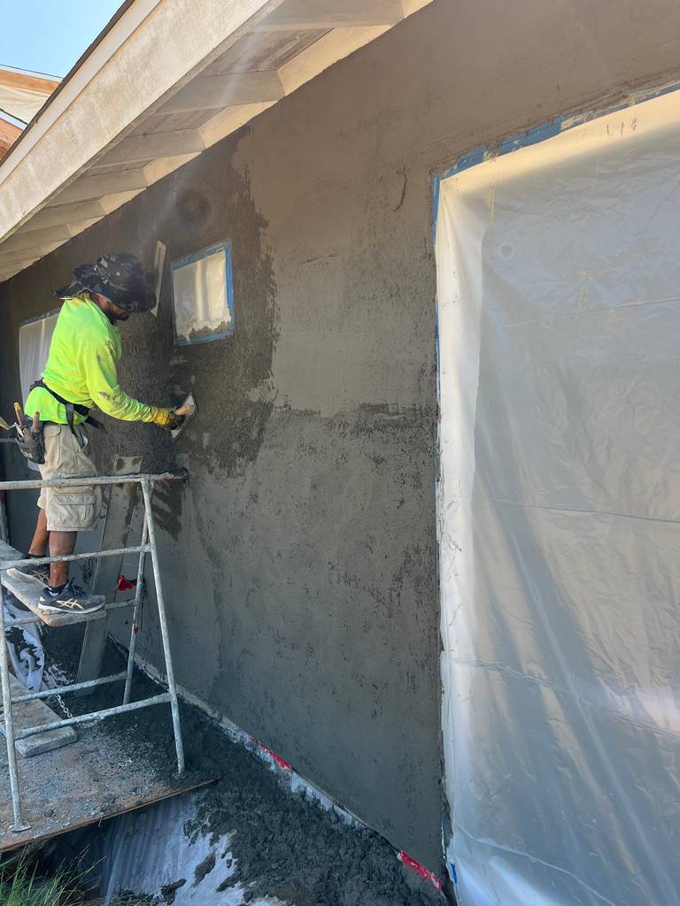 Craftsmen Applying Stucco with Expertise