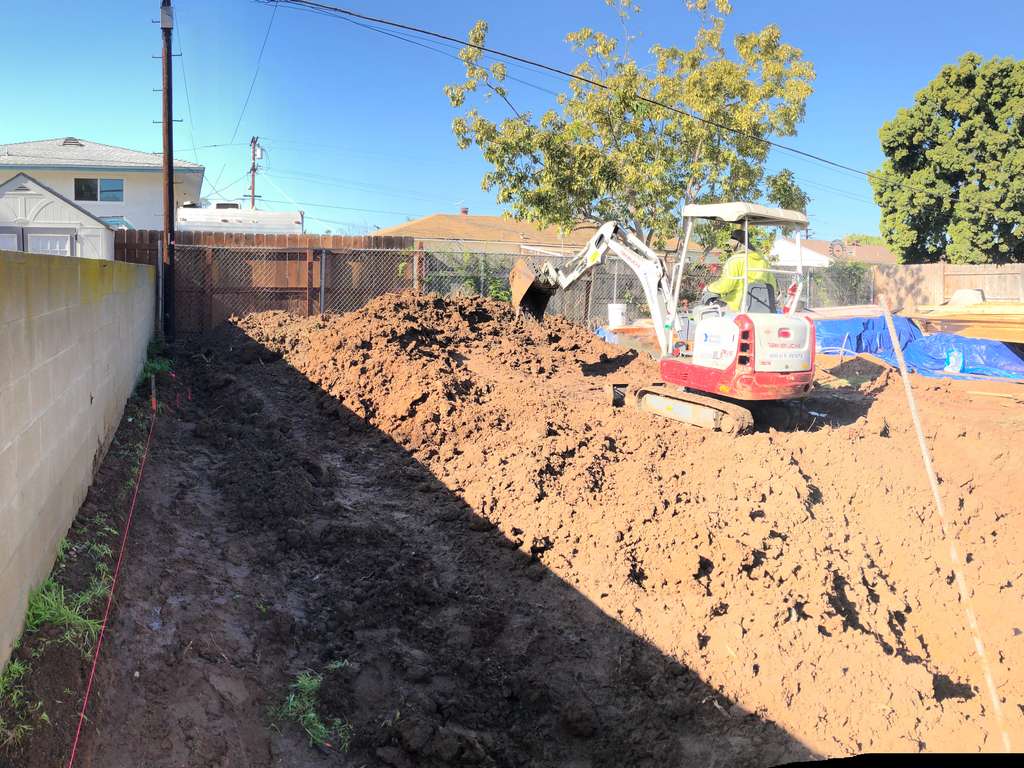 excavating the layout for the home addition