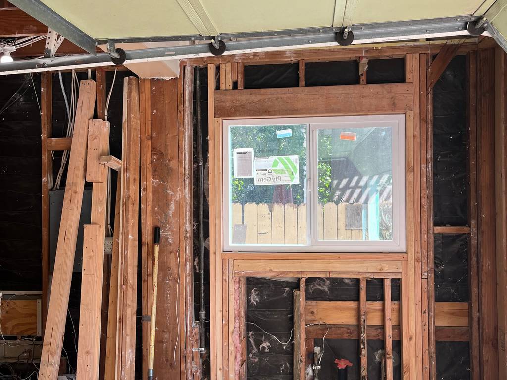 Garage Conversion: Unveiling Open Frame and Electrical Connections