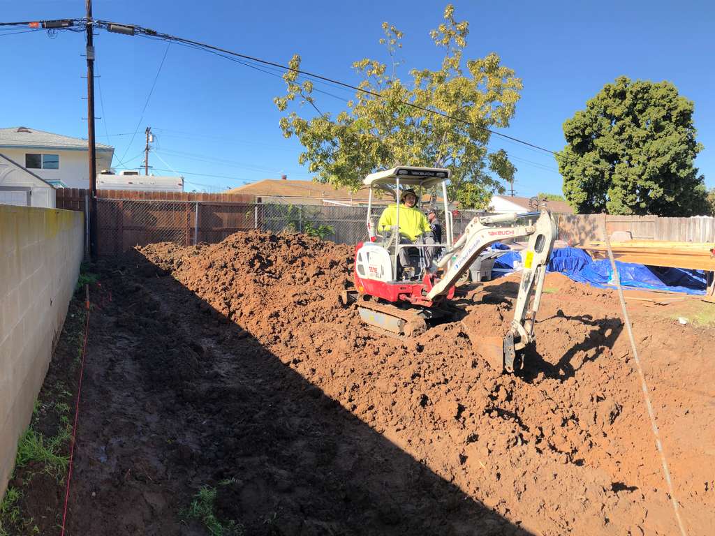 digging the foundation for the home addition