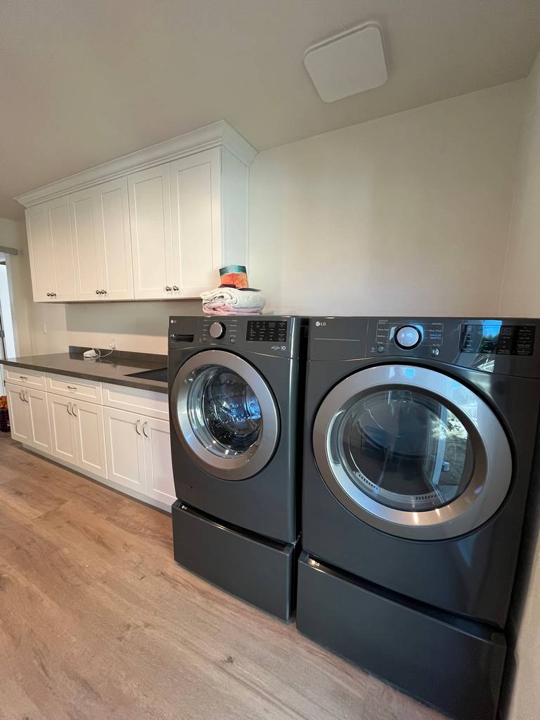 Modern laundry room with prominent LG appliances.