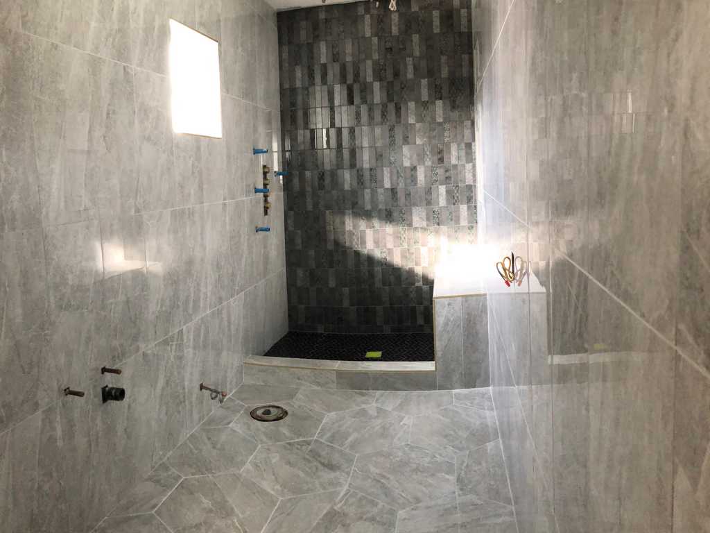 walk-in shower finshed, window walls and shower bench