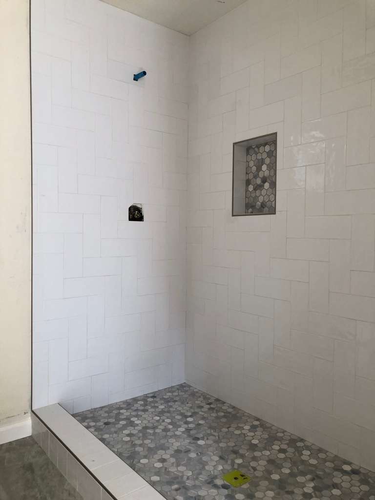 new shower with beautiful custom tile work