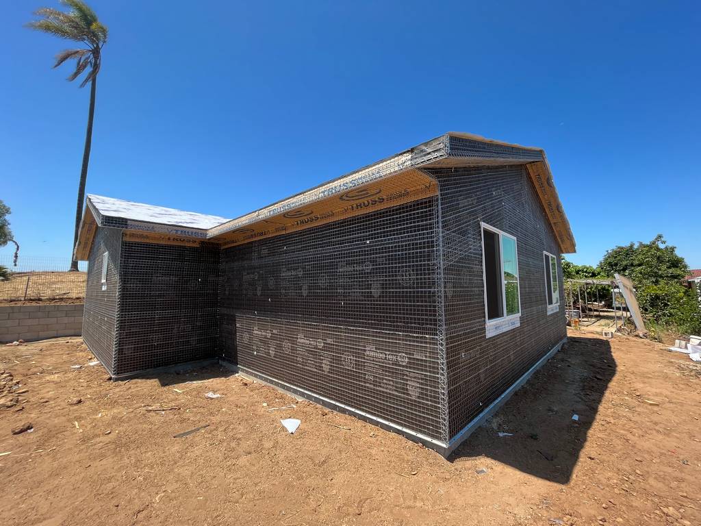  wraping exterior walls with waterproof tar paper with wire mesh