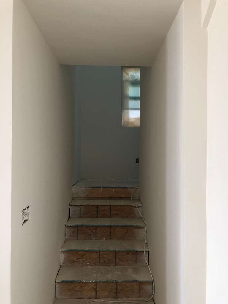 sheetrock-applied-to-stairway-walls-in-home-addition