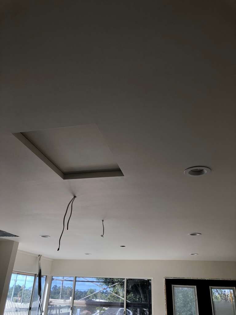 drywall-work-on-the-ceiling-in-home-addition