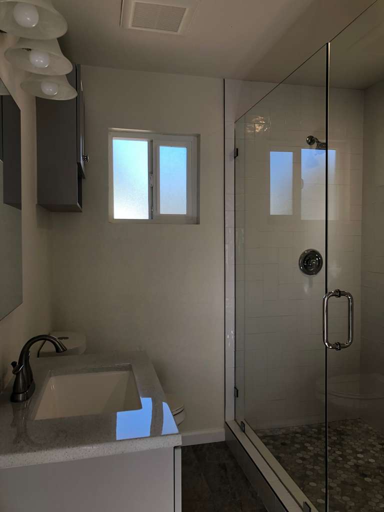 frameless glass shower in the new bathroom