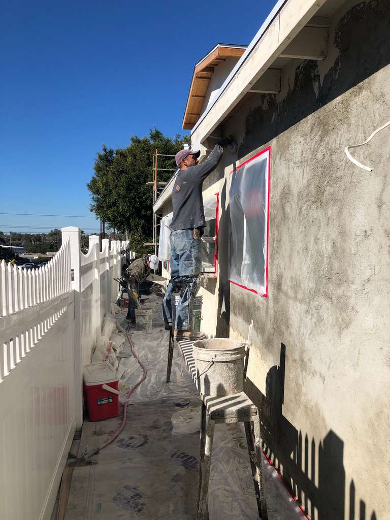 stucco-final-color-finish-being-applied