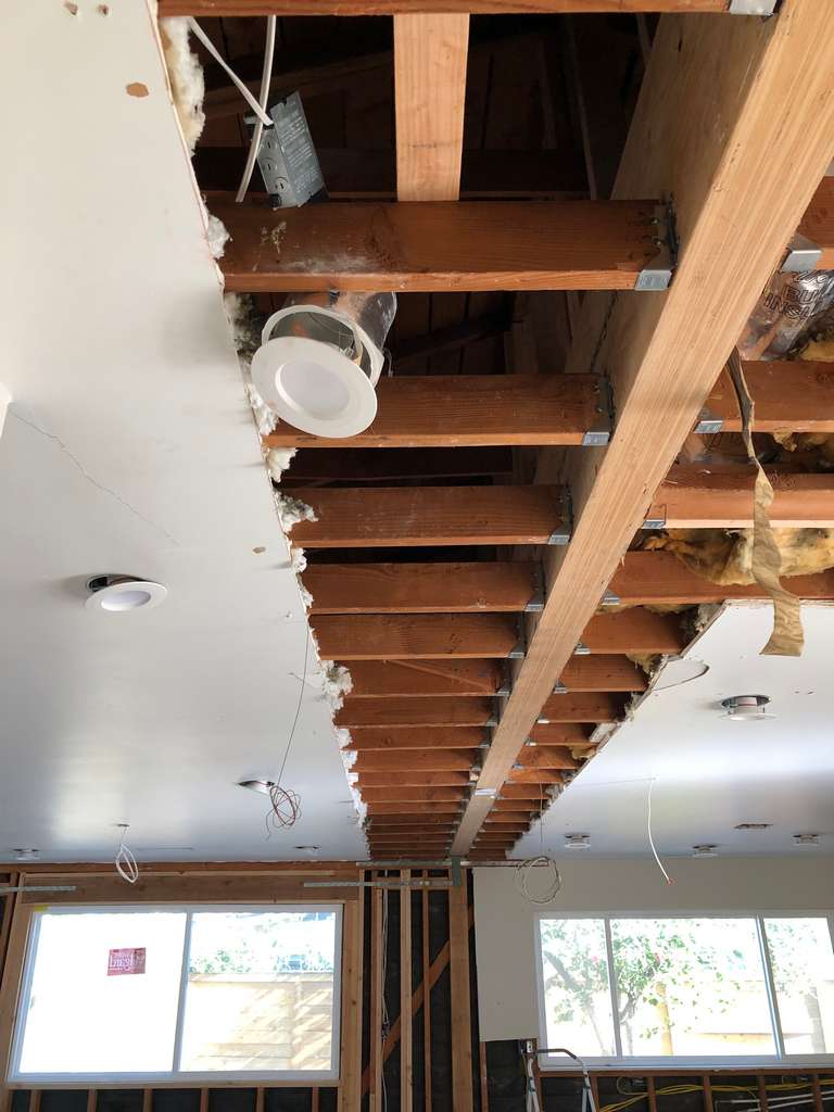 recessed lights installed between ceiling joists