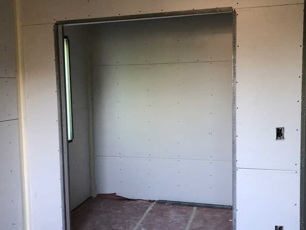 ADU showing drywall secured to the wood frames