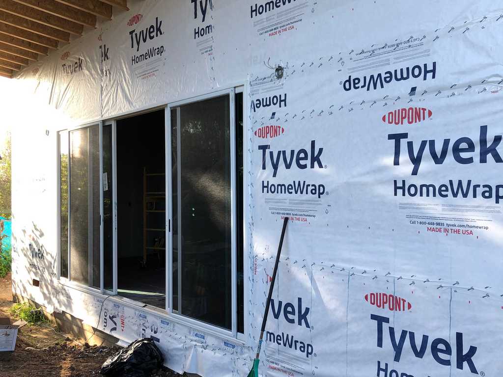 Tyvek HomeWrap used keep air and water out, while letting water vapor escape