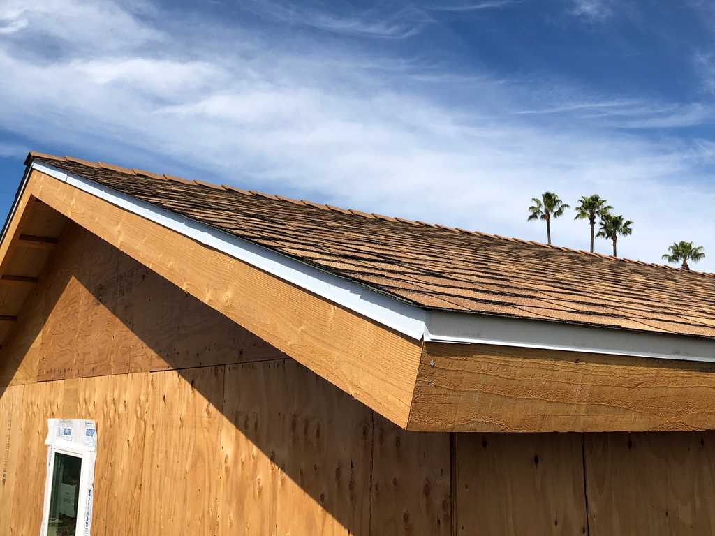 ADU showing new roof, sheating panels and vinyl window