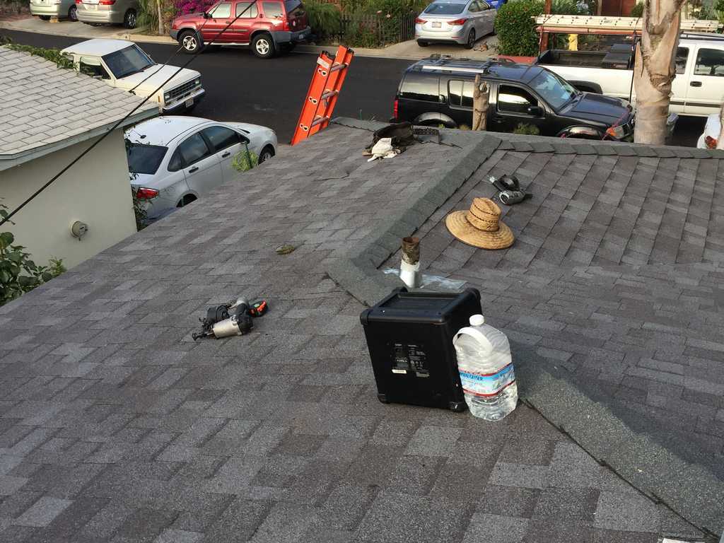 a2m contractors wrapping up a roofing project