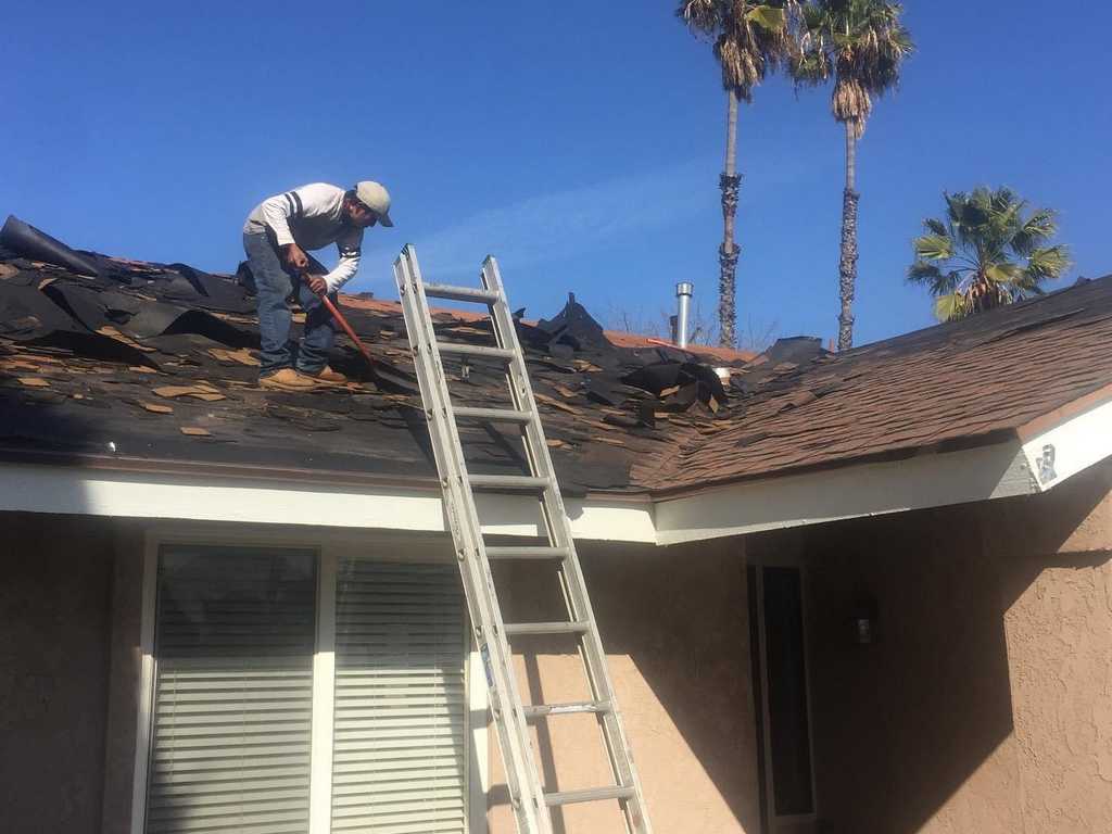a2m contractors removing damaged roof