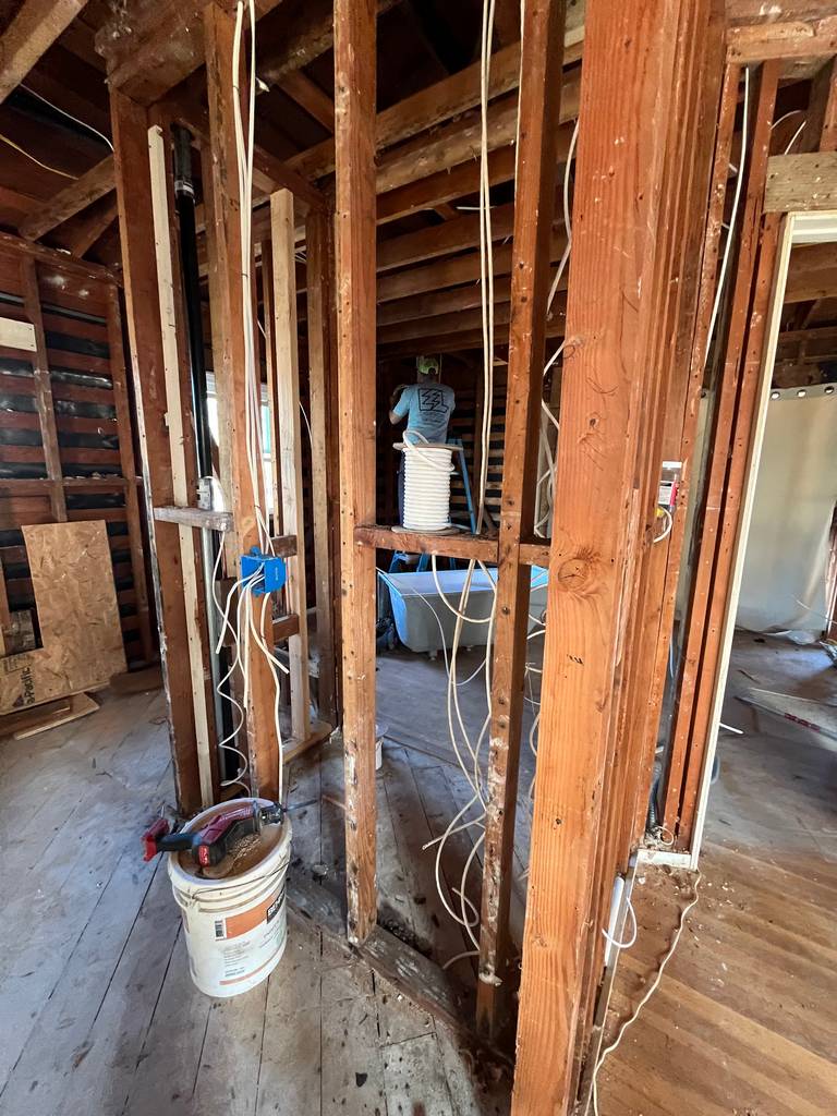 Bathroom framing with visible plumbing and wiring. (08)