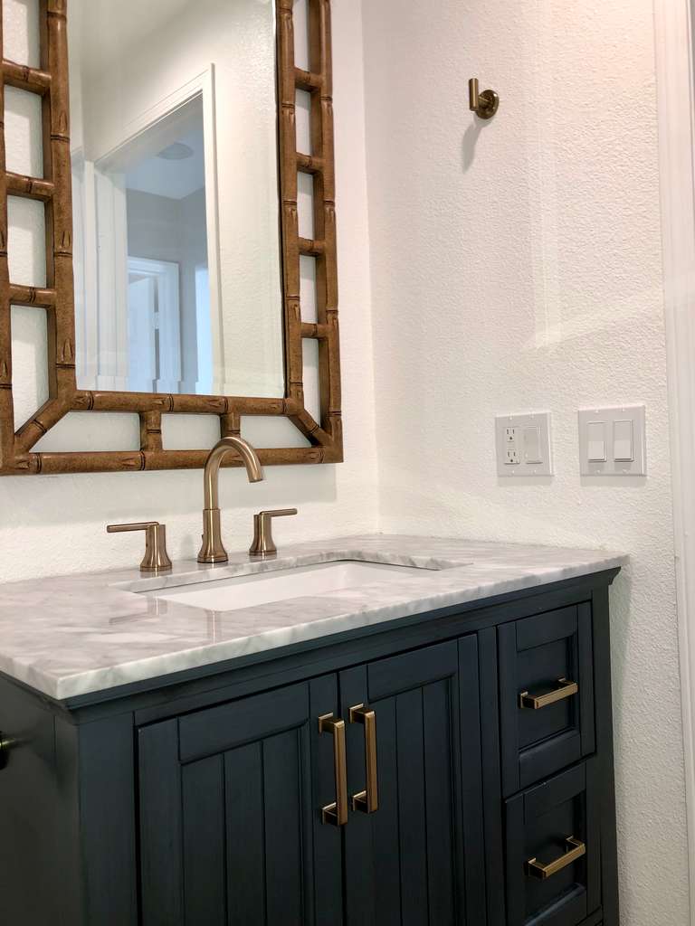 condo-remodel-showing-beautiful-vanity-and-bamboo-framed-mirror